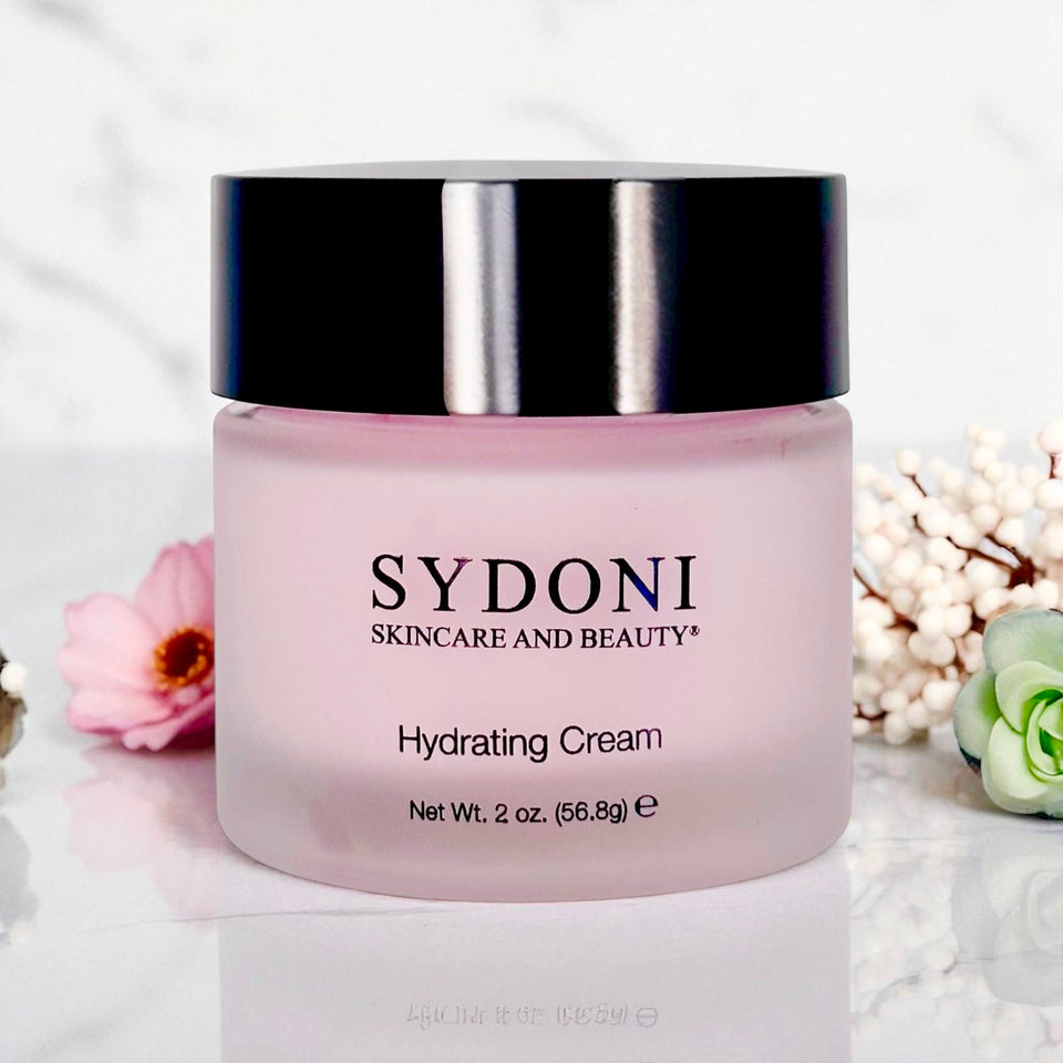 Sydoni hydrating cream jar with decorative flowers on a light background